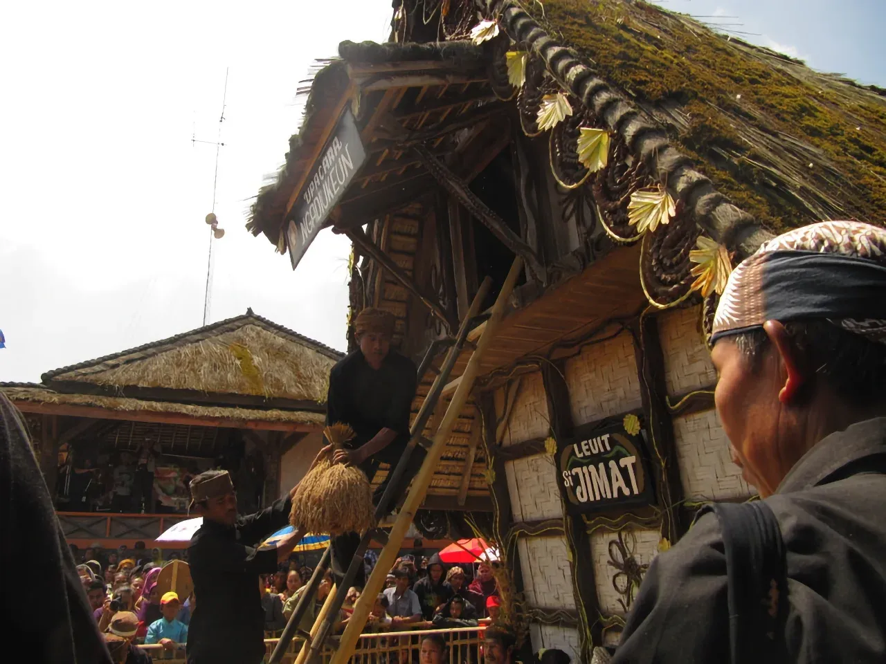 Putting rice into Leuit si Jimat, the sacred rice barn of the Kasepuhan Ciptagelar indigenous community during the Seren Taun ceremony. Photo: Ridzki R. Sigit